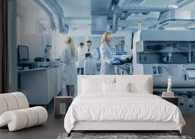 Team of Research Scientists Working On Computer, with Medical Equipment, Analyzing Blood and Genetic Material Samples with Special Machines in the Modern Laboratory. Wall mural