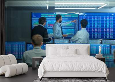 three experienced stock traders talking business, consulting documents and argue about data. they wo Wall mural