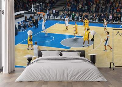 TV Broadcast Style Footage of Two International Teams Playing Basketball at a Professional Arena. Both Teams Dribble, Pass the Ball, Score Goals During an Intense World Championship Match. Wall mural