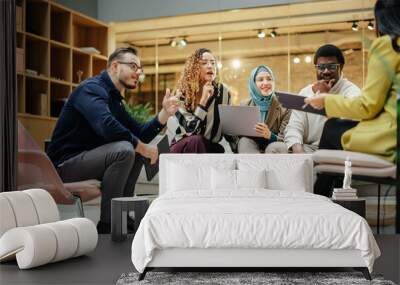 Wide Shot of a Multiethnic Group of People Discussing Ideas in a Meeting Room at Office. Businesspeople Making Creative Decisions For their Startup and Discussing Options Wall mural