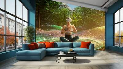 Young Athletic Woman Wearing Virtual Reality Headset, Practising Meditation in Futuristic Way. Her Consciousness is Transformed into Beautiful and Peaceful Forest. Online Wellbeing and Mindfulness. Wall mural