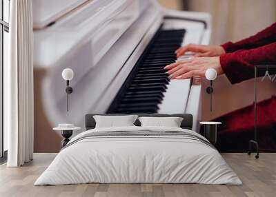 Pianist playing on a white piano. Hands close up. Wall mural