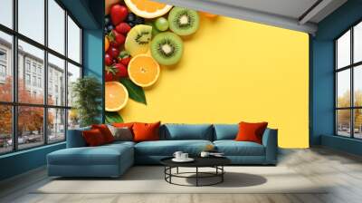 Tropical sliced colorful fruit on yellow colored background top view in flat lay style. Healthy eating backdrop or Summer Sale Banner.
 Wall mural