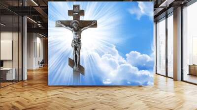 Silhouette of the crucified Jesus Christ on the cross against the blue sky. The Biblical prophet is a symbol of death. Calvary, Christmas, Easter background. Wall mural