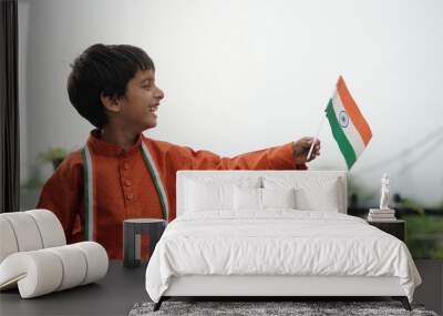 Cute little boy with Indian National Tricolour Flag. Suitable for Independence Day or Republic Day concept Wall mural