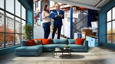 Caucasian business mature man and woman in the warehouse Wall mural