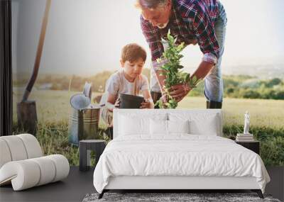 Grandfather and grandson planting a tree Wall mural