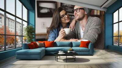 Happy man and woman in cafe Wall mural