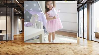 Little cute fairy with magic wand Wall mural