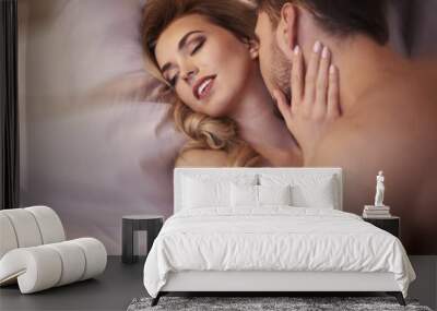 Sexual scene of young adult couple Wall mural