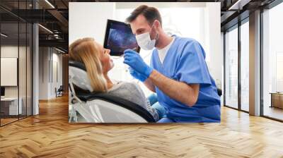 Side view of stomatologist doing his work in dentist's clinic Wall mural