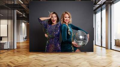 Two women with disco ball partying Wall mural