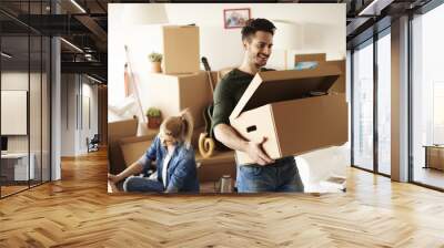 Young couple moving in to house Wall mural