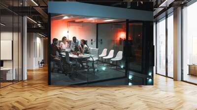 Teamwork is the best kind of work. colleagues having a meeting during a late night in a modern office. Wall mural