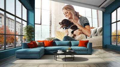 Woman, dog and calm smile on sofa in living room for animal care, love and support in home. Young female, pet care and relax peace on couch, playful and happiness lifestyle together with therapy dog Wall mural