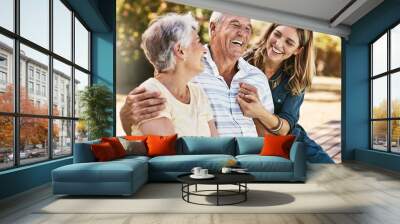 Woman, grandparents and hug for family summer vacation, holiday or break together in the outdoors. Happy grandma, grandpa and daughter with smile in joyful happiness, love or care for elderly parents Wall mural