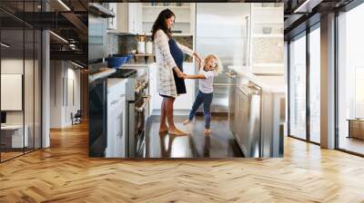 Happy family, pregnant woman with boy child and in kitchen at their home with lens flare. Mother with love or care, mother and cheerful parent with son bonding with dance in their house together Wall mural