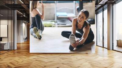 Portrait, stretching and women training, balance and workout for stress relief, wellness and healthy lifestyle. Face, female people and athletes on the floor, stretch legs and practice with progress Wall mural