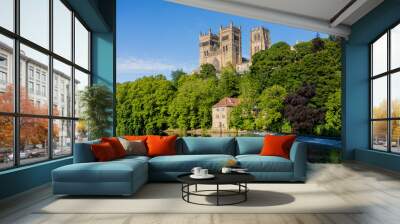 Durham England: 2022-06-07: Durham Cathedral exterior during sunny summer day. View from river wear with lush green trees Wall mural