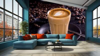 cup of coffee with beans on a black background Wall mural