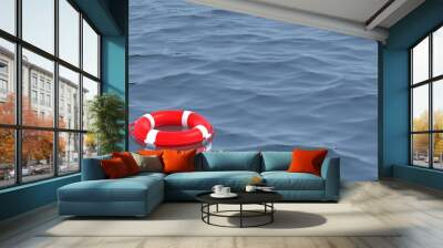 Red life buoy on the ocean. 3D Render. Wall mural