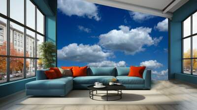 Blue sky with perfect white fluffy clouds receding to horizon Wall mural