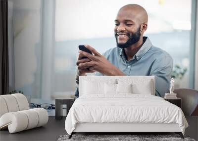 Black man in office, check social media on smartphone and smile at meme, lunch break and communication. Male employee at workplace, using phone and technology, mobile app and contact with chat Wall mural