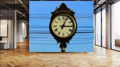 Vintage style black and gold metal clock in Bucharest, Bucuresti. Romania.  Wall mural