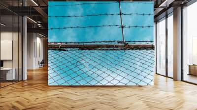 Metal fence with barbed wire Wall mural