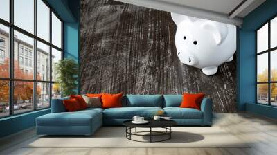 Piggy bank on the black surface Wall mural