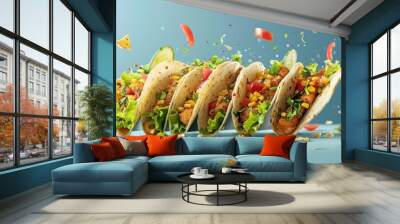 a group of tacos with lettuce, corn and tomatoes Wall mural