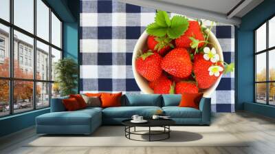 Bowl of fresh strawberries on checkered cloth with copy space Wall mural