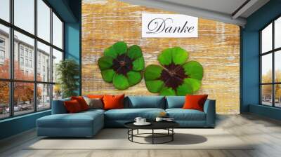 Danke (thank you in German) card with two shamrocks on wooden surface Wall mural