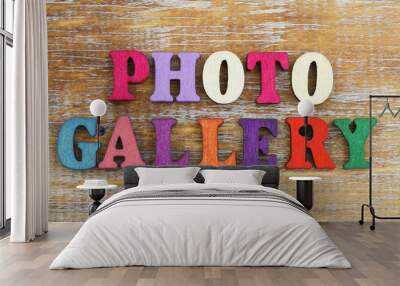 Photo gallery written with colorful letters on rustic wooden surface
 Wall mural