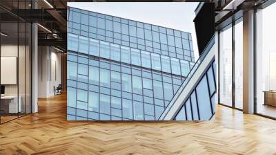 Facade fragment of a modern office building. Exterior of glass wall with abstract texture. Wall mural