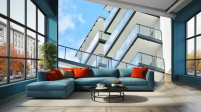 Fragment of modern luxury residential apartment,  home house building concept. Modern apartment building on a sunny day with a blue sky. Wall mural