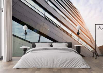 Glass and aluminum facade of a modern office building. View of futuristic architecture. Office building with cloud reflection on windows Wall mural