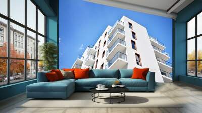 Modern apartment buildings on a sunny day with a blue sky. Facade of a modern apartment building Wall mural