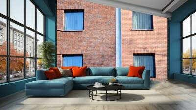 Modern apartment buildings on a sunny day with a blue sky. Facade of a modern apartment building Wall mural