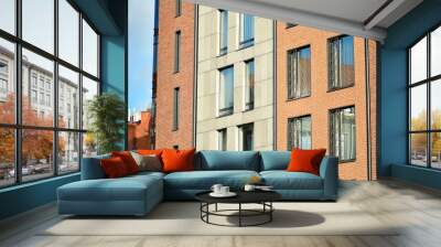 Modern apartment buildings on a sunny day with a blue sky. Facade of a modern apartment building Wall mural