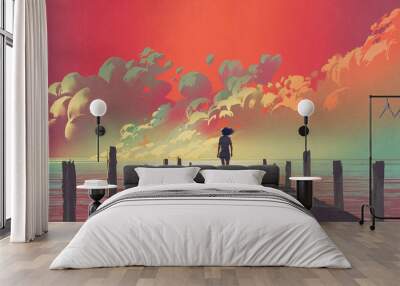 beautiful scenery of the woman standing alone on a wooden pier looking at colorful clouds in the sky Wall mural