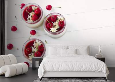 Cherry mousse in a glass , beautiful  dessert with fresh cherries , whipped creame and chocolate sprinkles, empty space for text Wall mural