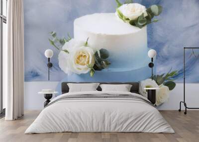 Two tiered modern  blue wedding cake with white roses and eucalyptus Wall mural