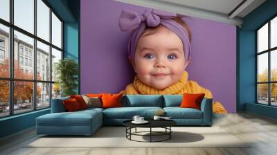 Baby with blue eyes and purple headband Wall mural