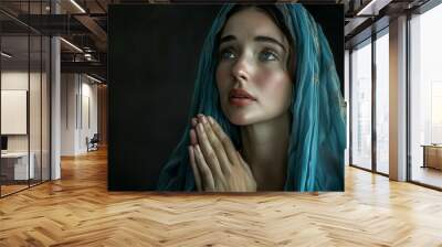 Young Woman in Prayerful Pose Seeking Solace Wall mural