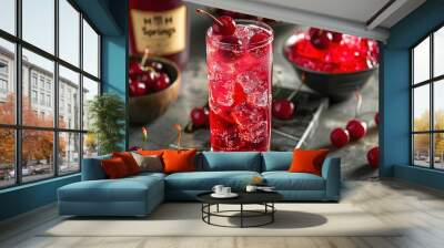 A glass of cherry juice with a cherry on top Wall mural