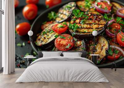 A grilled eggplant and tomato salad on a black plate Wall mural