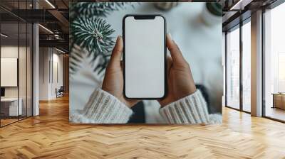 A person holding a cell phone with a white background Wall mural