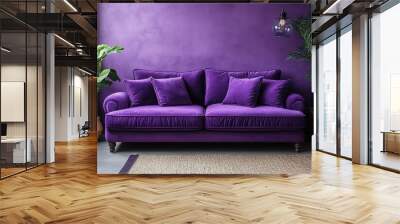 A purple couch sits in front of a purple wall Wall mural