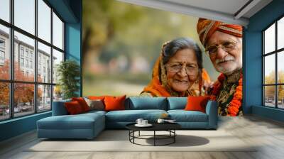 an elderly Indian couple dressed in traditional attire Wall mural